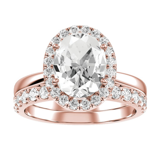 Rose Gold Oval Cut Diamond Engagement Ring With Halo Setting and Matching Wedding Band